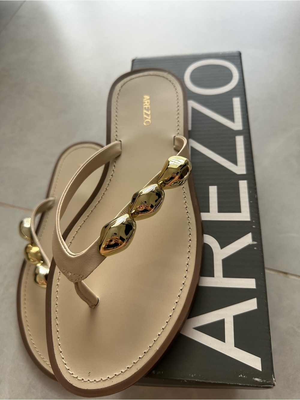 Arezzo Women's Nude Thong Sandals with Gold Accent
